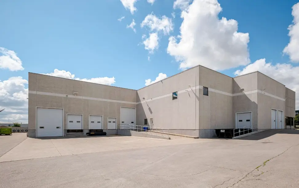Shipping side of 37 Nixon Rd with truck-level and drive-in doors