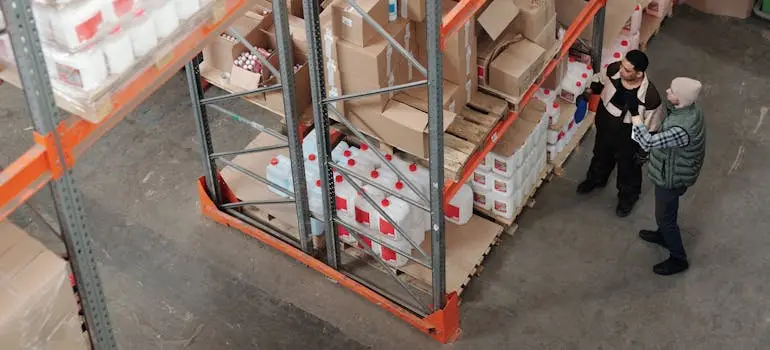 Two men talking in a warehouse